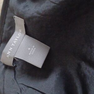 Ann Taylor black and white  boxed mini skirt. It is a size 4.